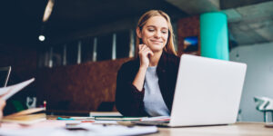 Woman engaging in a SMART recovery program on her laptop